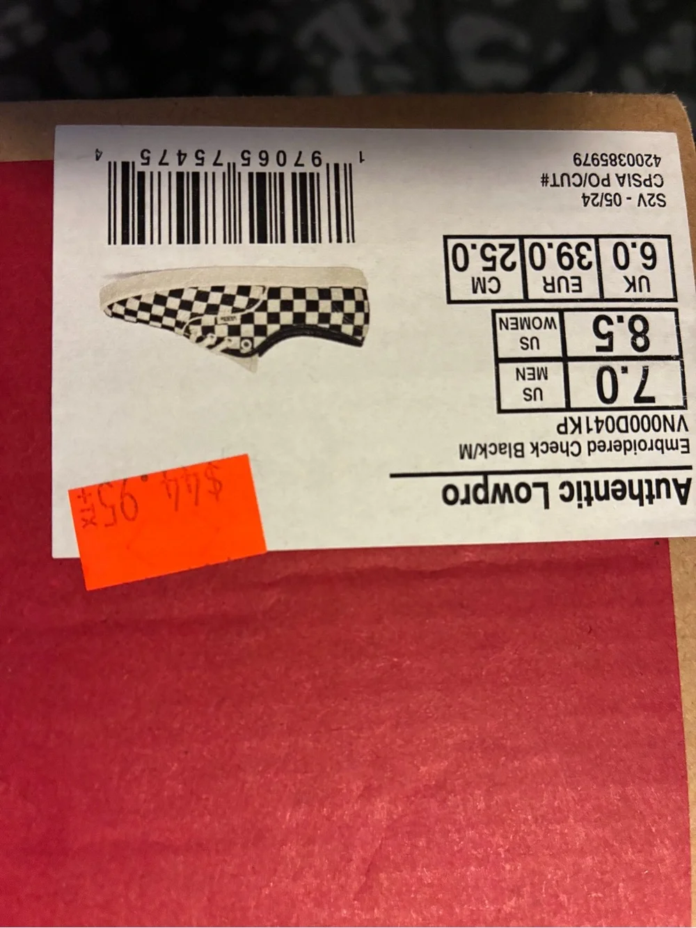 Vans Black and White Checkerboard Slip-On Sneakers